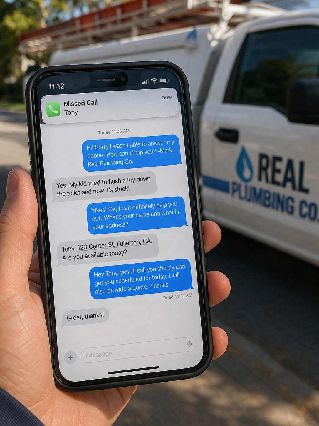 A plumber holding a phone showing an instant text-back conversation with a customer, with a work truck in the background.